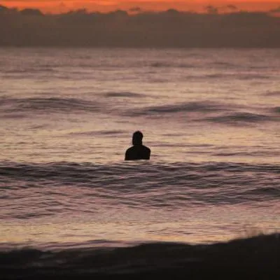 Surfer waiting for a wave during a scored heat